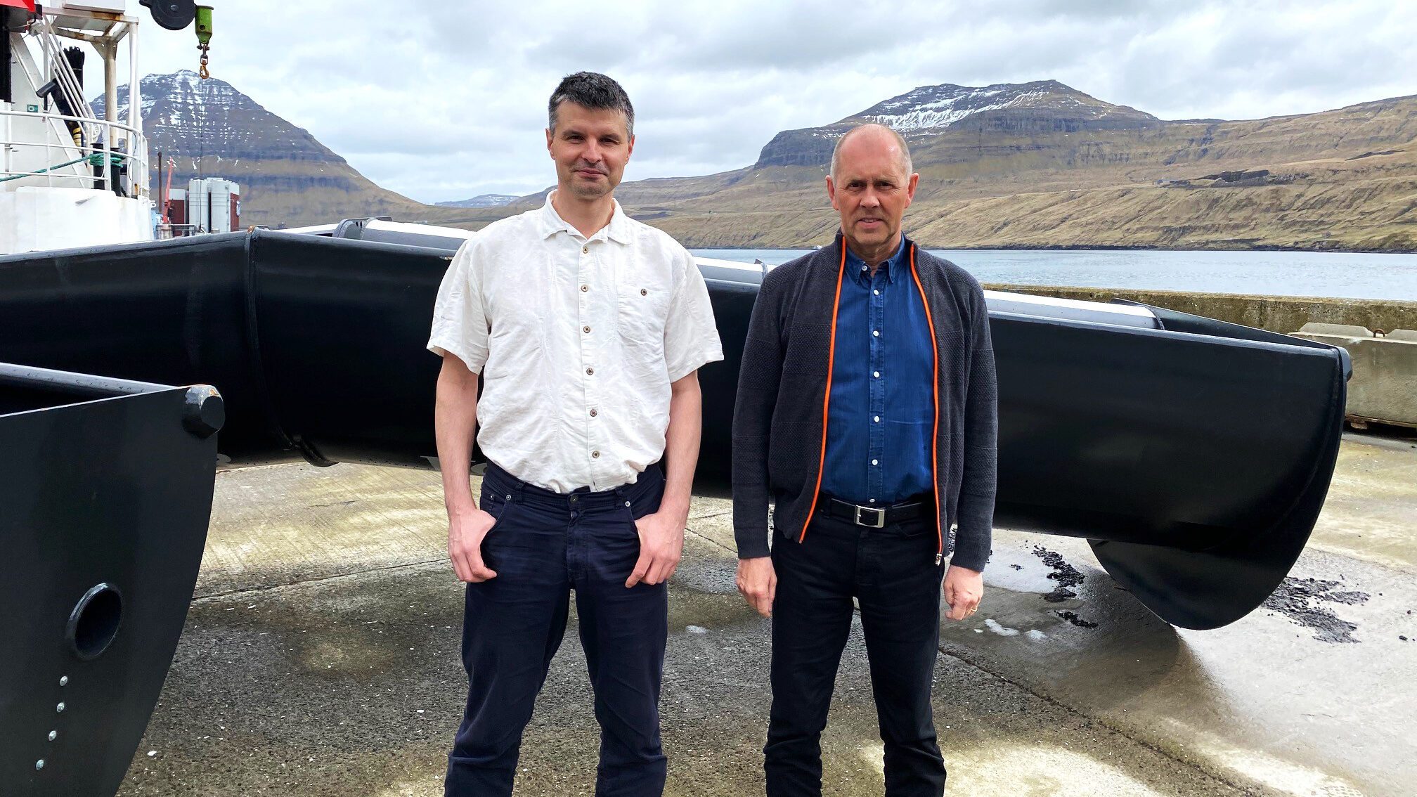 Søren Hjort and Hjalmar Petersen standing in front of a set of Twister trawl doors.