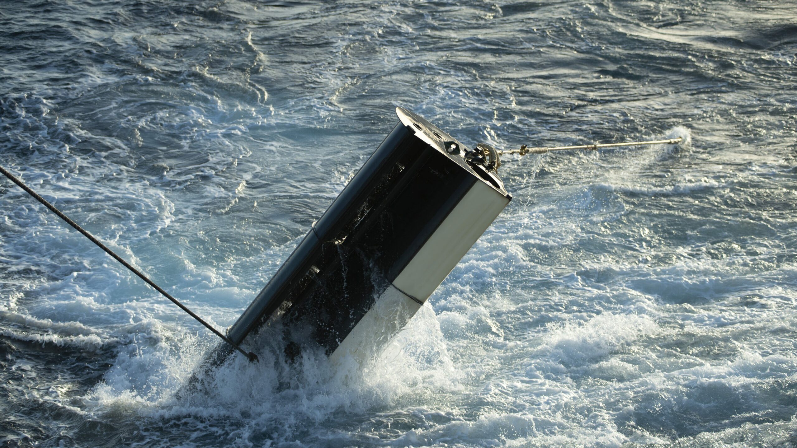 The Twister trawl door being lowered into the ocean for full scale testing 